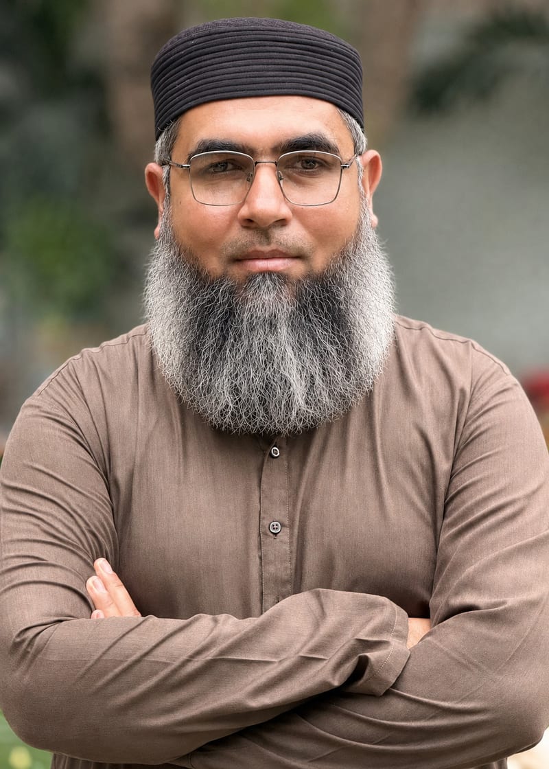 A warm, professional portrait of Mr. Ahmed Faraz, founder of Mirfaq International.